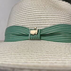 The Masters Dorfman and Pacific wide brim hat green stripped ribbon and logo